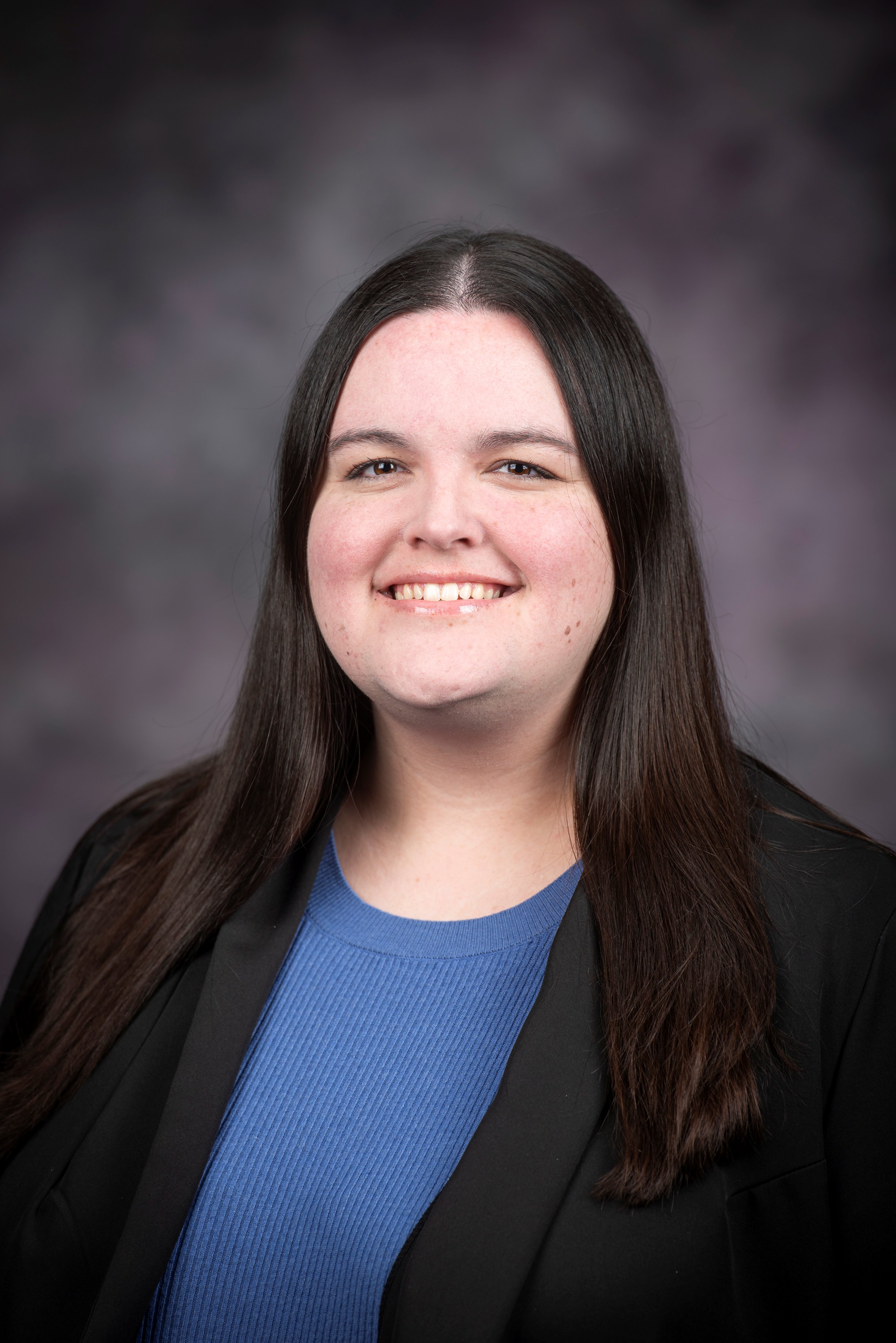 Portrait photo of a woman with brown hair